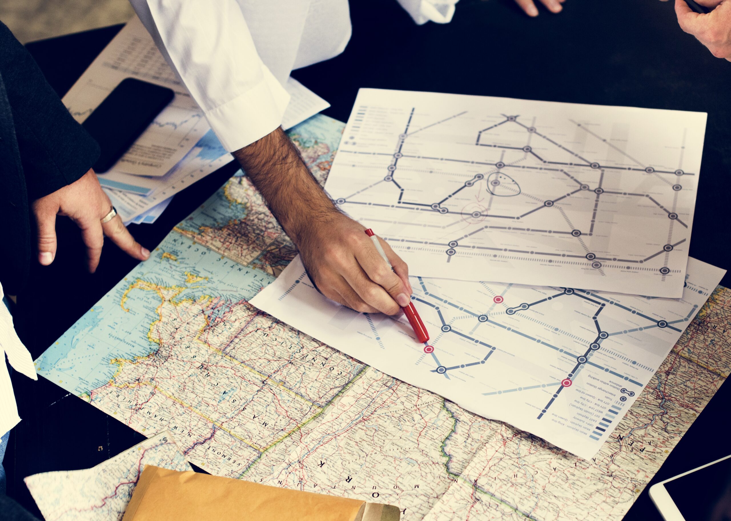 Emergency response team using map to plan evacuation routes.